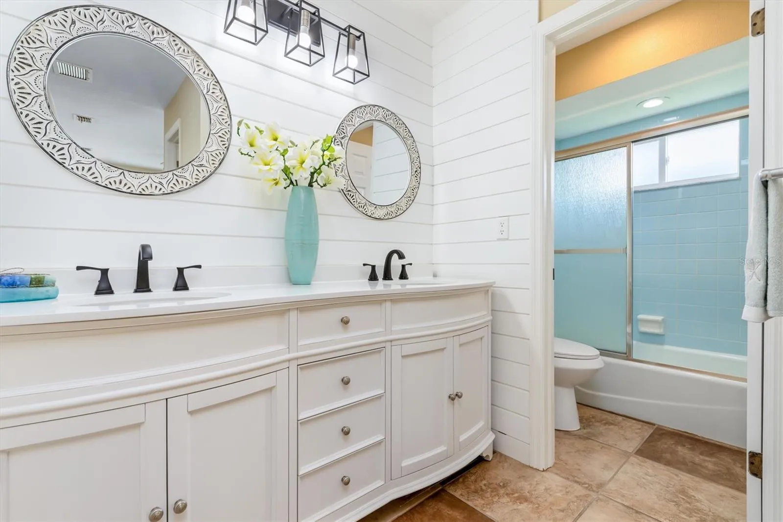 Primary bathroom with brand new cabinet &amp; accent wall.