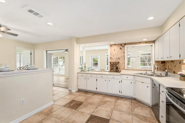 SMOOTH ceilings to natural light in the large kitchen