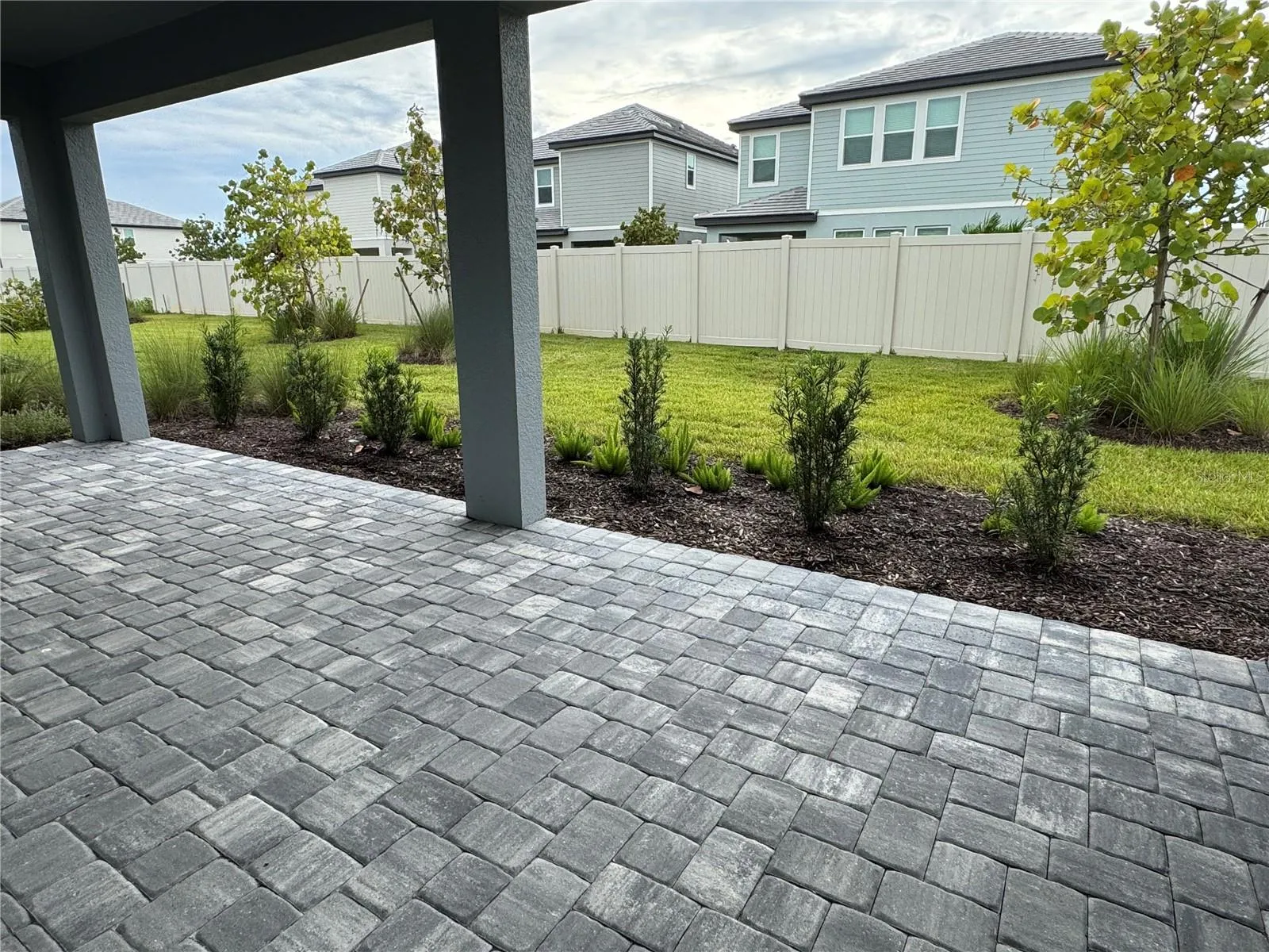 Covered lanai with pavers and out door kitchen stub-out