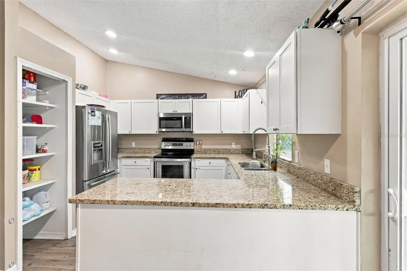 Stainless Steel appliances, stone countertops.