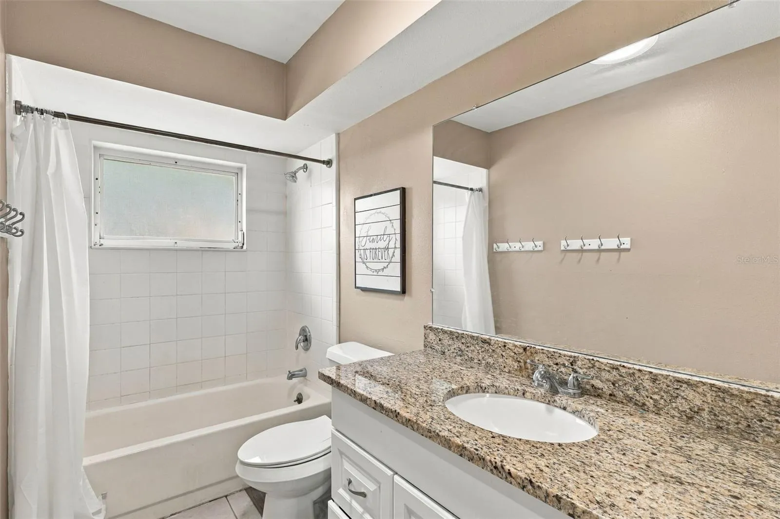 Bathroom 2- Stone countertops, bath/shower combo