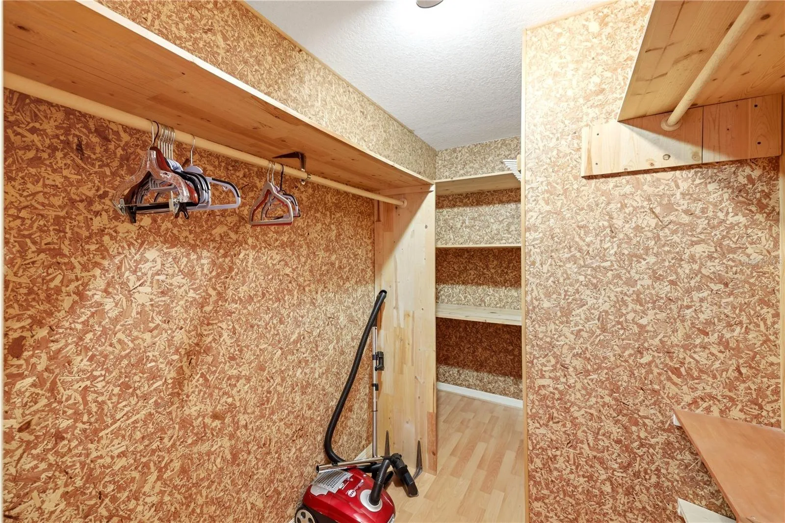 walk-in cedar-lined primary bedroom closet