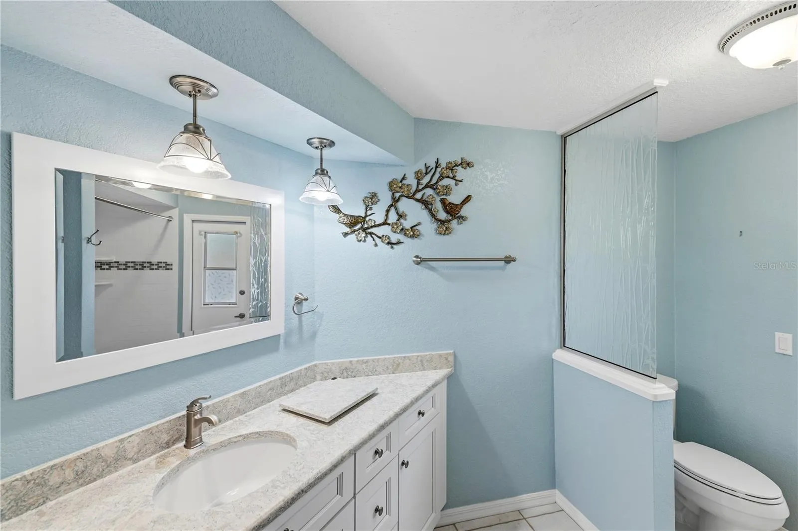 remodeled guest bathroom opens to the lanai