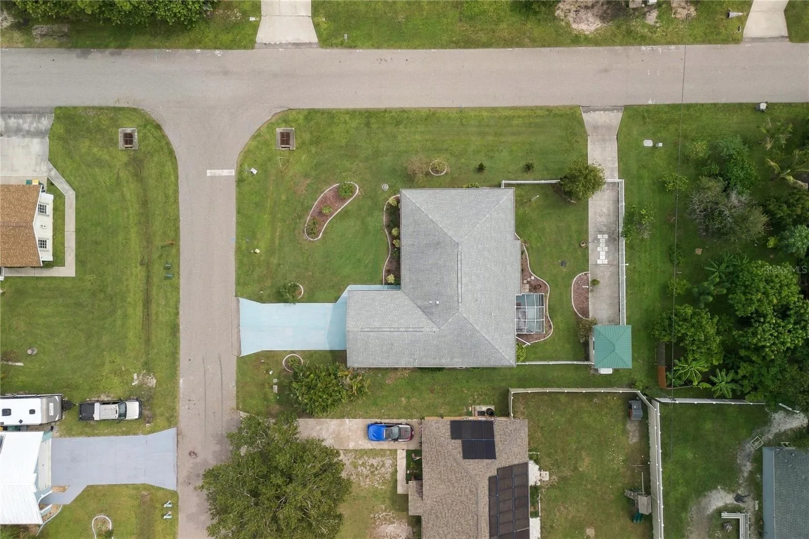 extra driveway parking space leads to the detached backyard shed