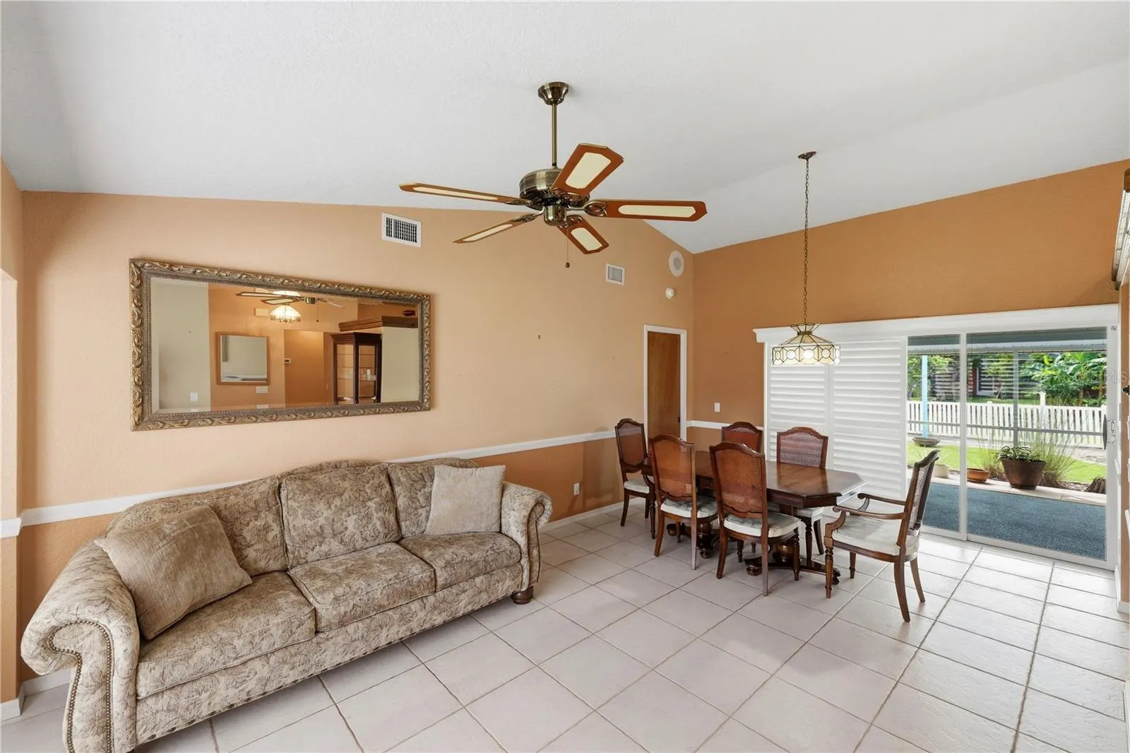 Dining room sliders open to the lanai.