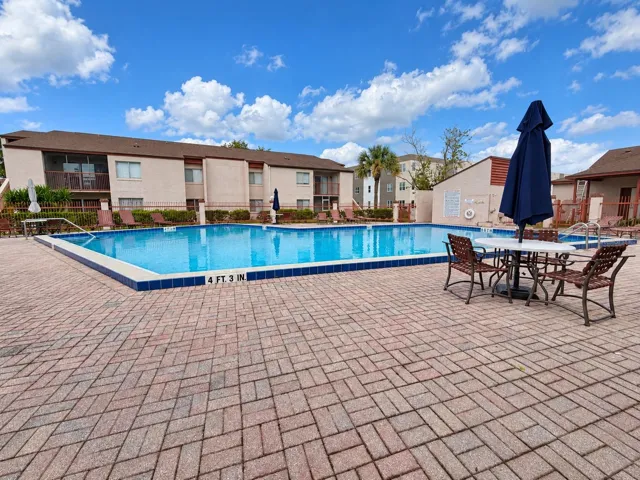 Sparkling pool and plenty of room for sunbathing on the pavered deck.