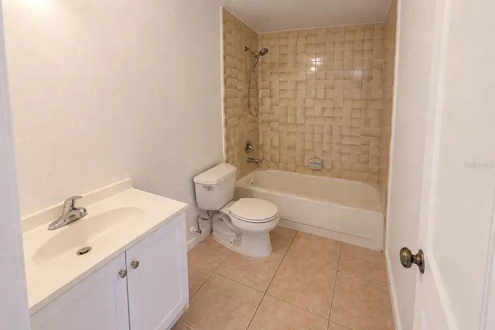 Bathroom 2 with updated shower enclosure and vanity.