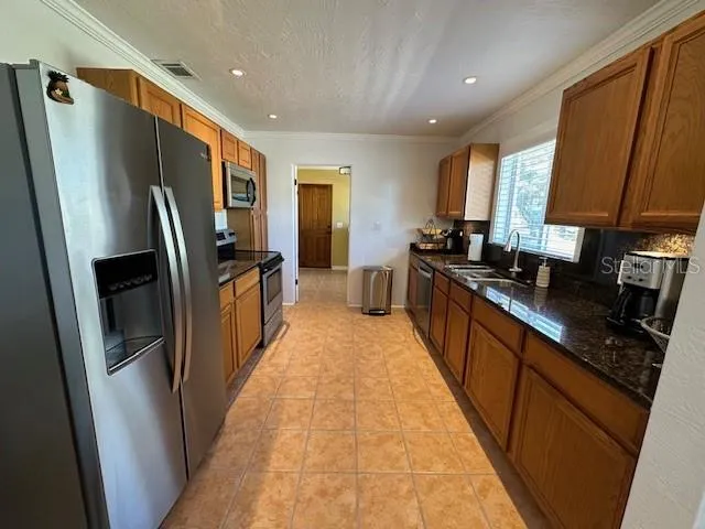 Kitchen looking to Office and door to laundry &amp; garage