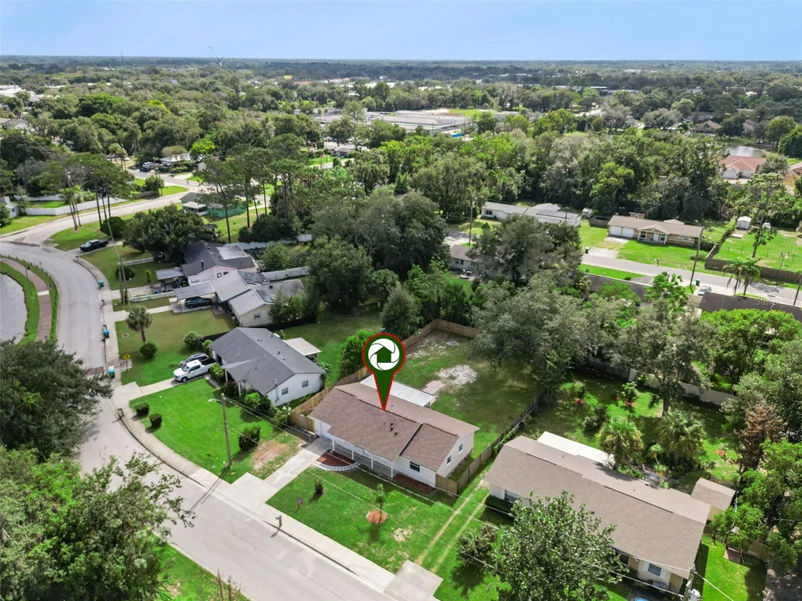 Aerial Location Pin: Neighborhood aerial view featuring a location pin directly identifying the property
