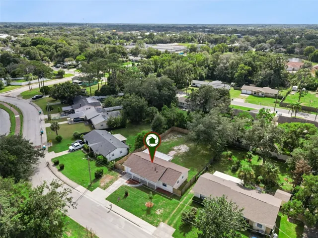 Aerial Location Pin: Neighborhood aerial view featuring a location pin directly identifying the property
