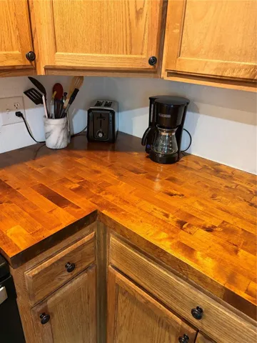 butcher block counter and wood cabinets