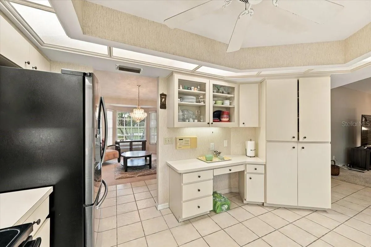 Kitchen with formal dining room to the right and family room to the left