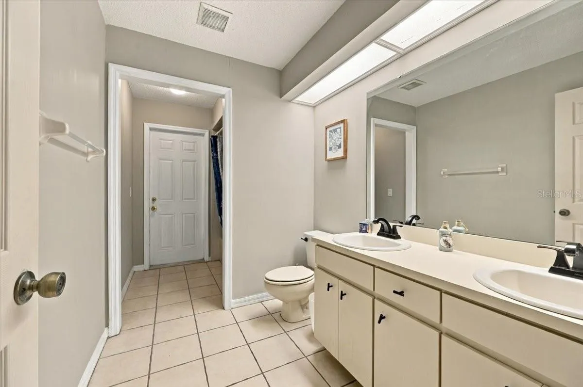 Guest bath with exit to rear patio