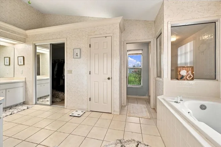Primary bath with separate garden tub and shower and water closet