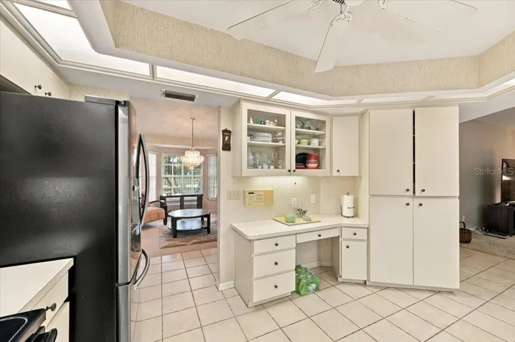 Kitchen with formal dining room to the right and family room to the left