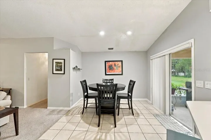 Breakfast Nook off of Family Room and Kitchen with Sliding Doors to the back screened lanai