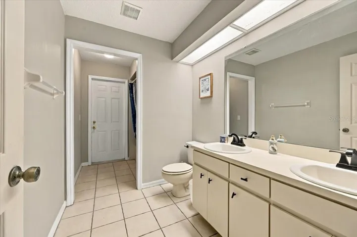 Guest bath with exit to rear patio
