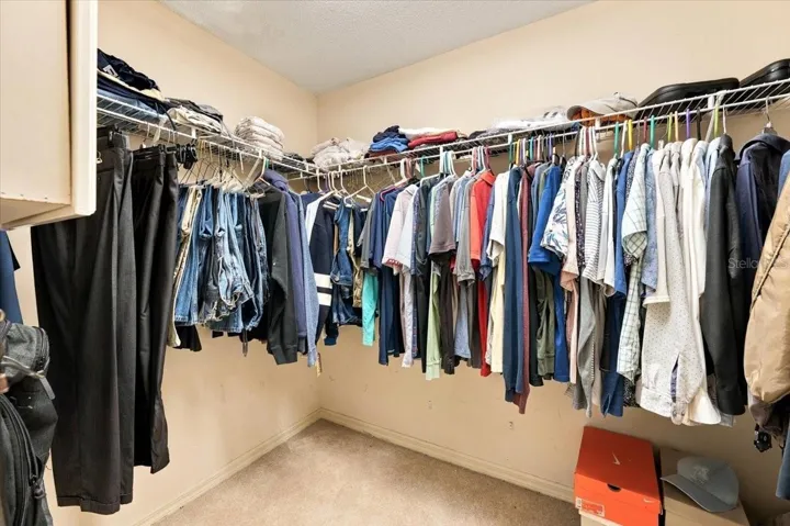 One of two walk in closets in primary bath