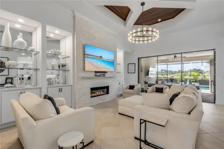 Gas fireplace with stacked stone surround.