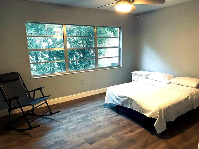 Bright bedroom with large window and natural light