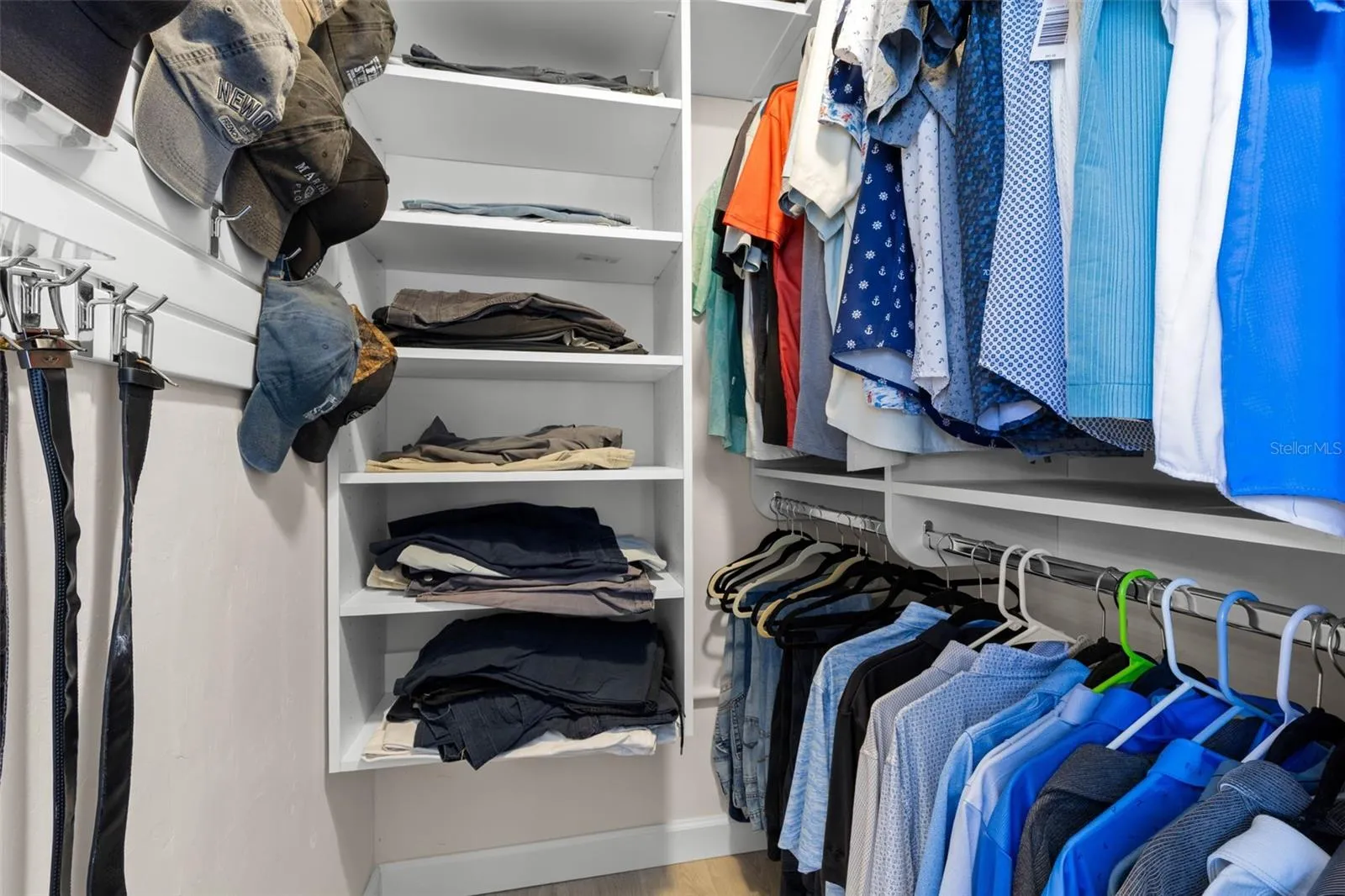 A well-organized walk-in closet in the primary suite offers built-in shelving, double hanging space, and plenty of room to keep clothing and accessories neatly arranged.