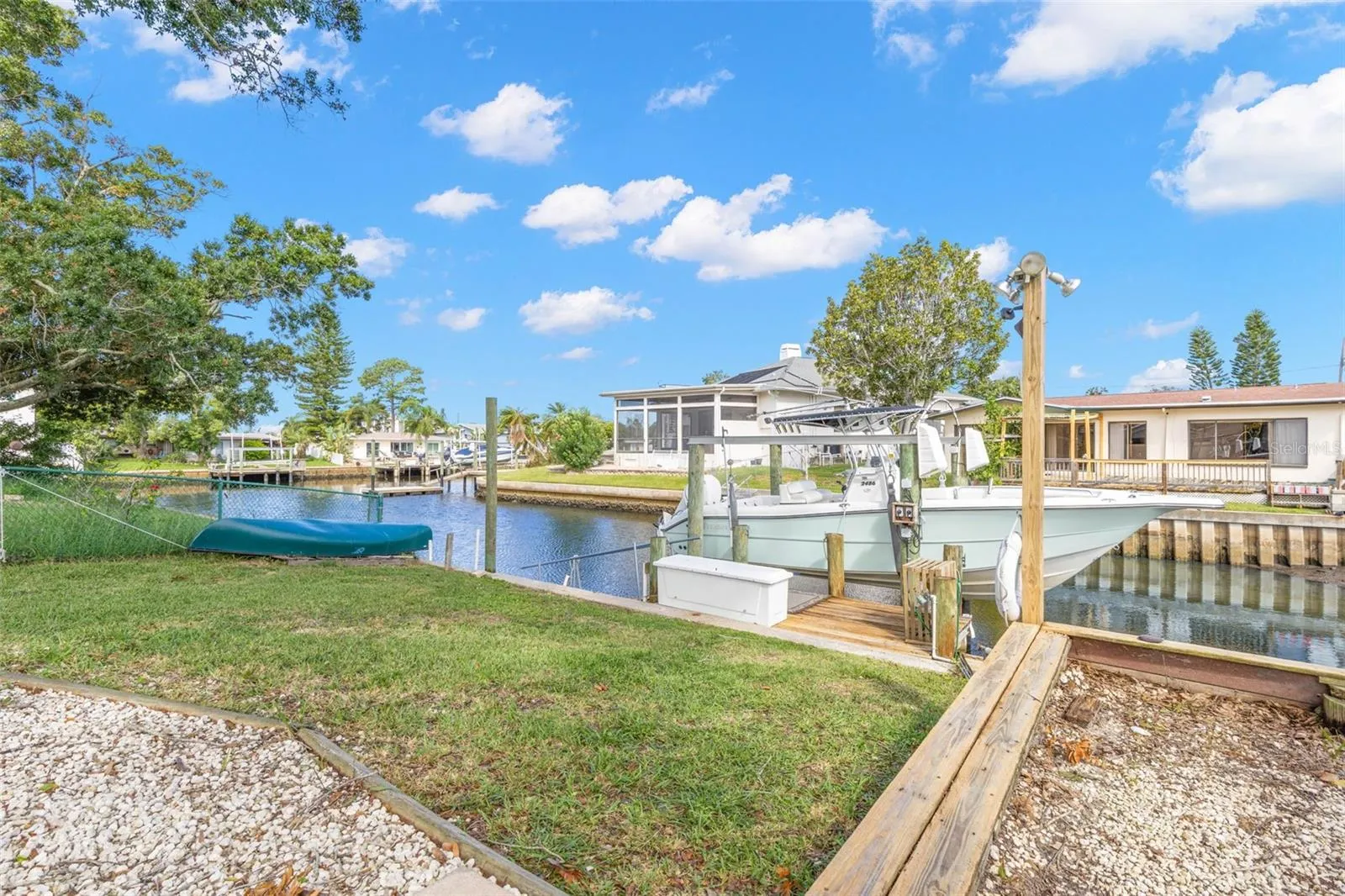Boating starts in your own backyard, with canal frontage, private dockage, a boat lift, and direct access toward the Gulf—all just steps from the lawn.
