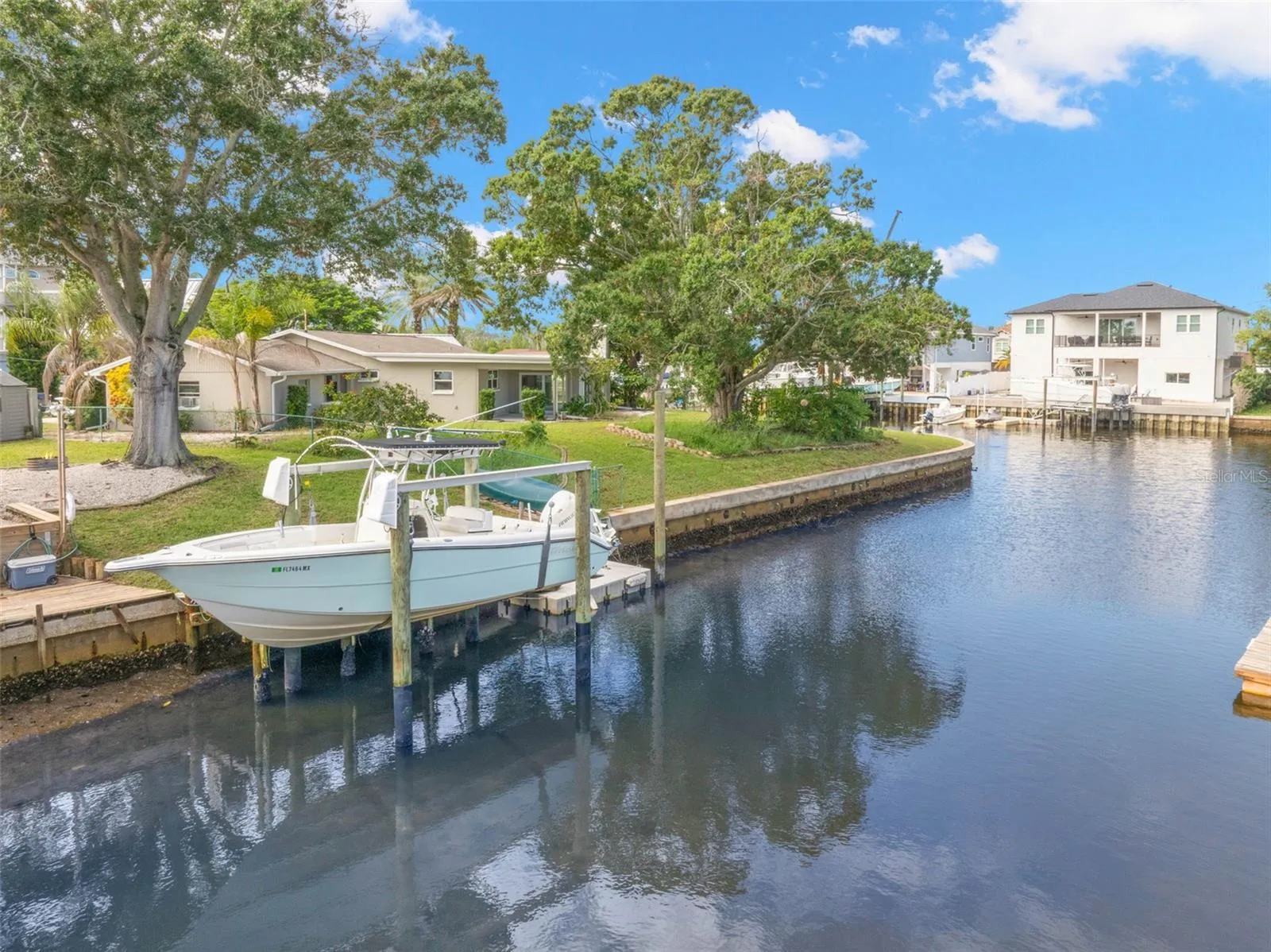 Set along a saltwater canal with Gulf access and no fixed bridges, the property’s 10,000-pound boat lift puts you just steps from getting out on the water.