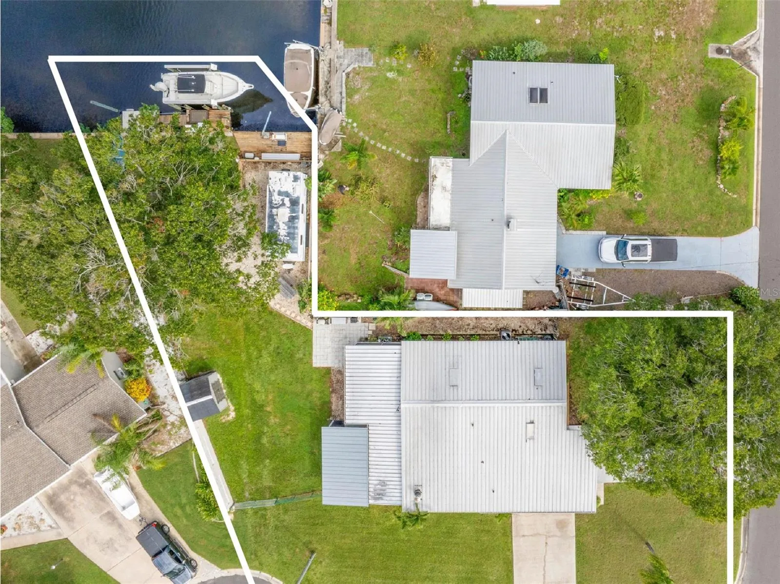 A straight-down aerial view highlights the property from street to canal, showing the generous yard, long driveway, screened lanai, RV parking area, and private waterfront setup all in one frame.