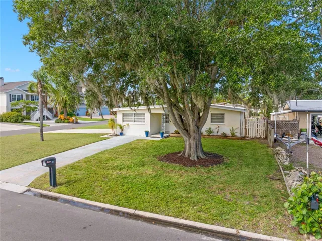 magnificent mature oak anchors the broad front lawn, while the home’s corner setting creates a wonderful sense of space and separation from neighboring properties.