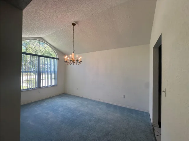 Dining Room with vaulted ceiling