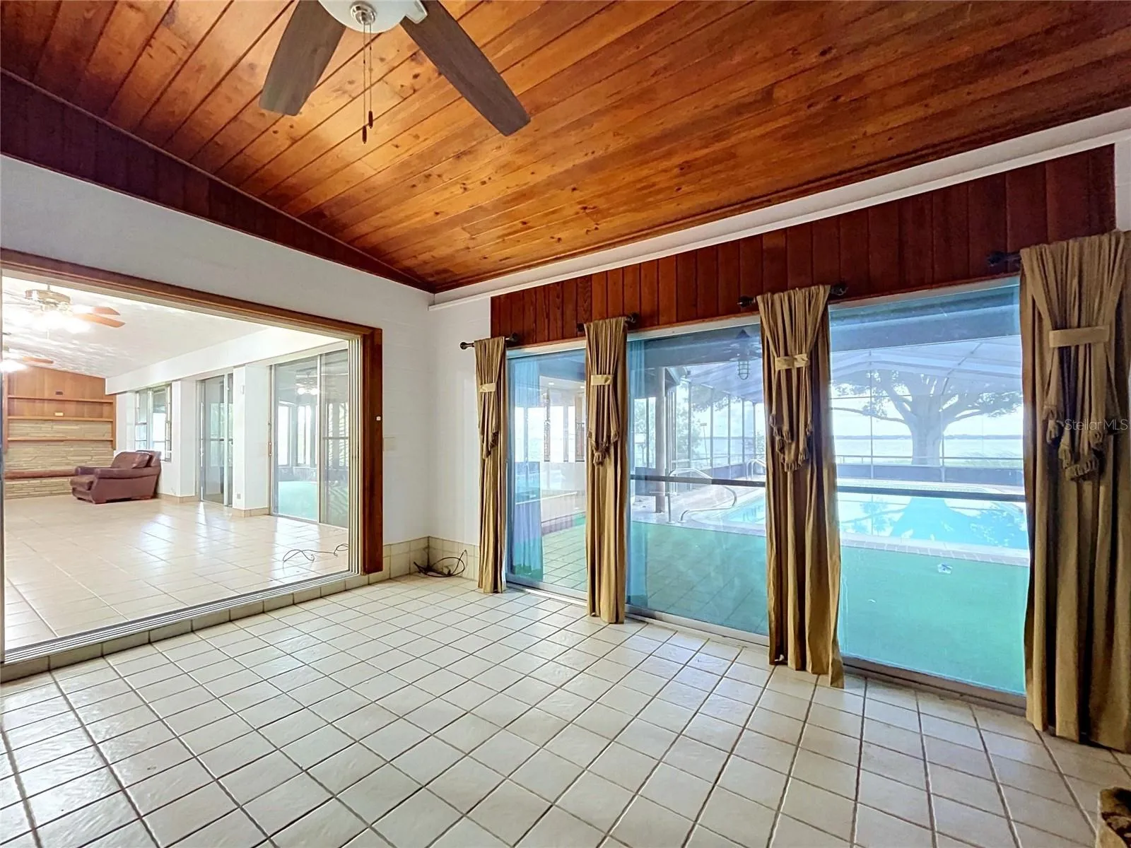 Family room with wood-paneled ceiling