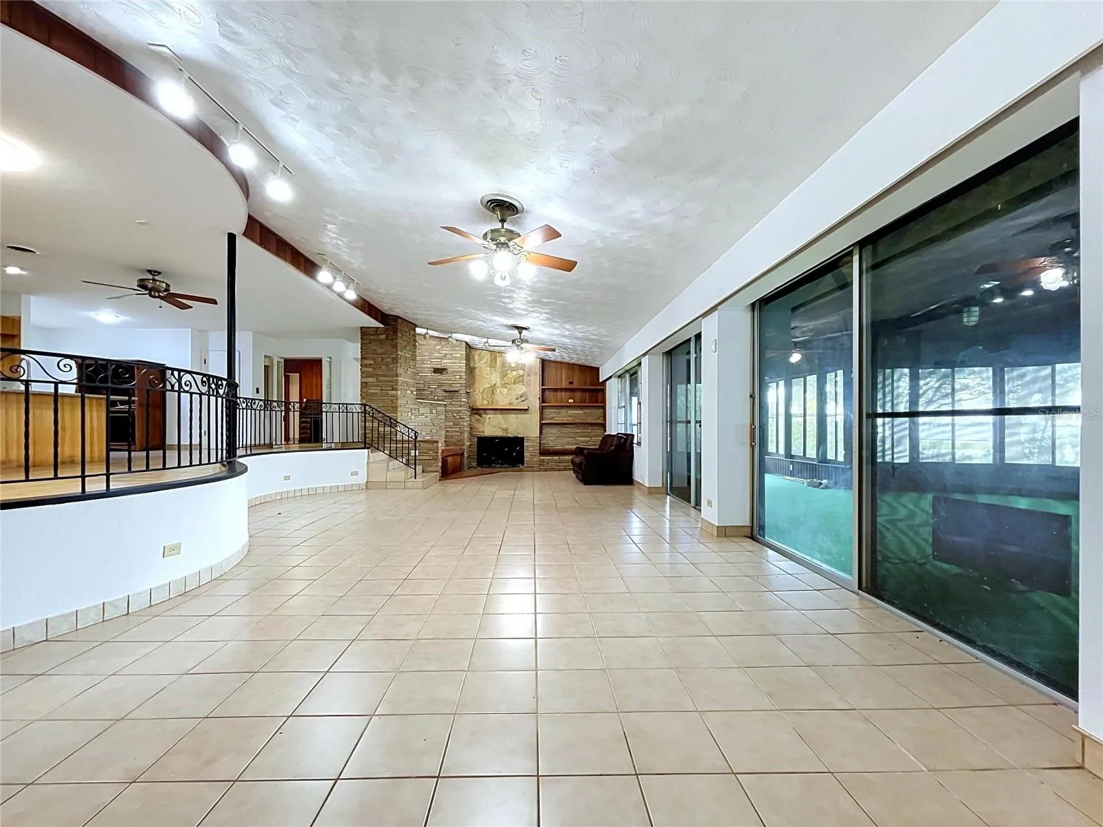 Main living area with views toward the lanai and backyard