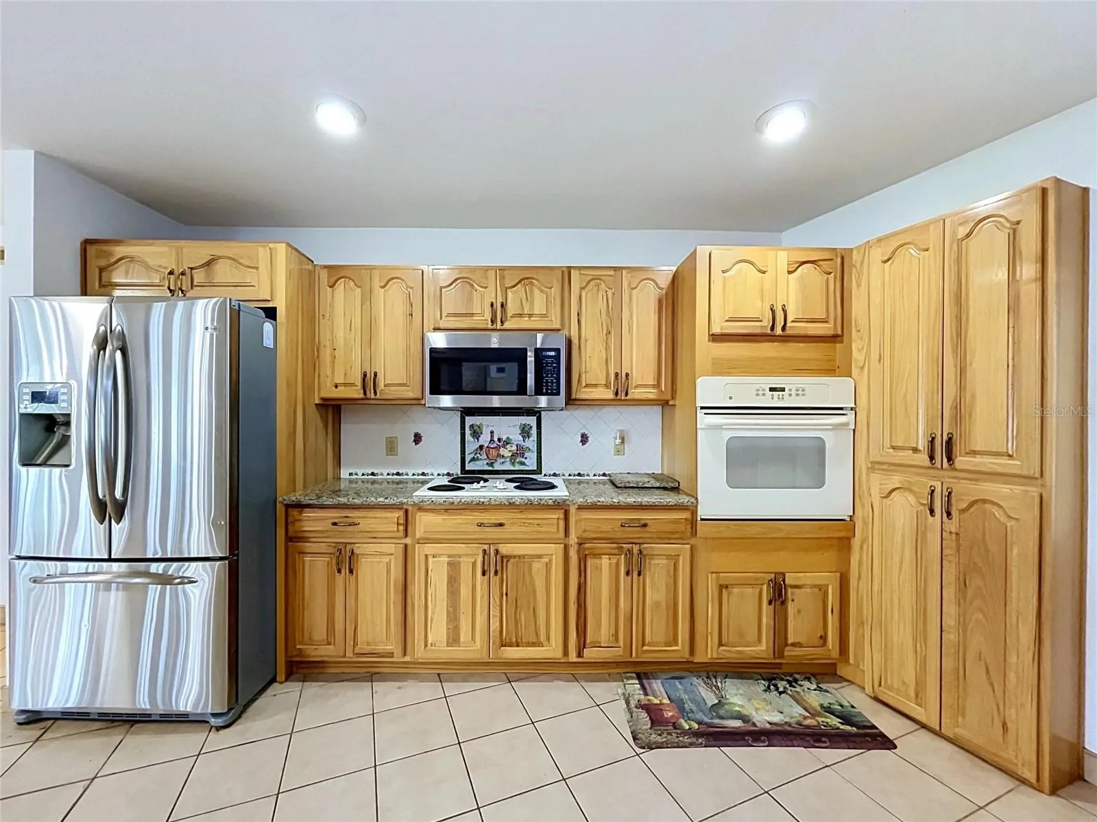 Kitchen cabinetry, countertops, and appliances