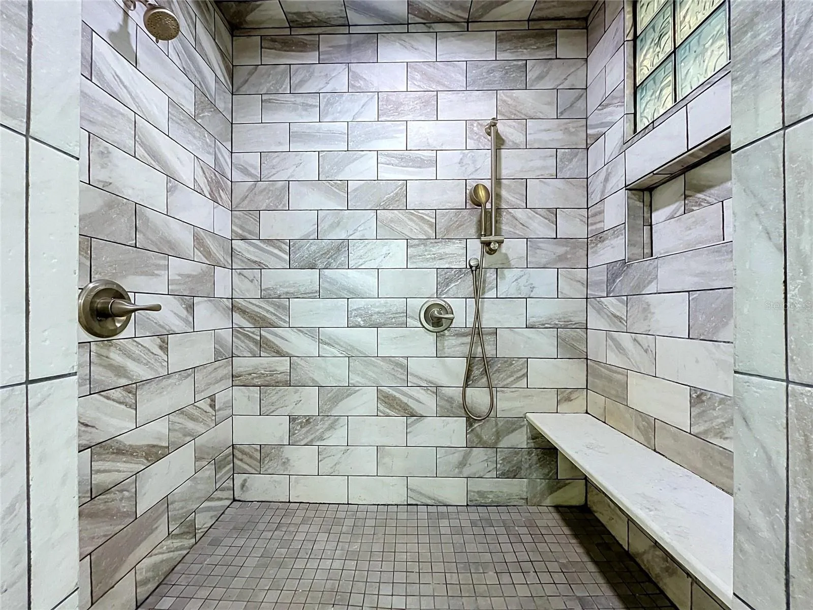 Bathroom 1 walk-in shower with tiled walls