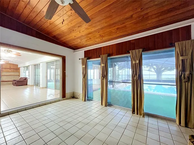 Family room with wood-paneled ceiling