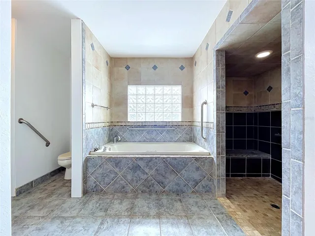 Bathroom 3 with bathtub and separate shower