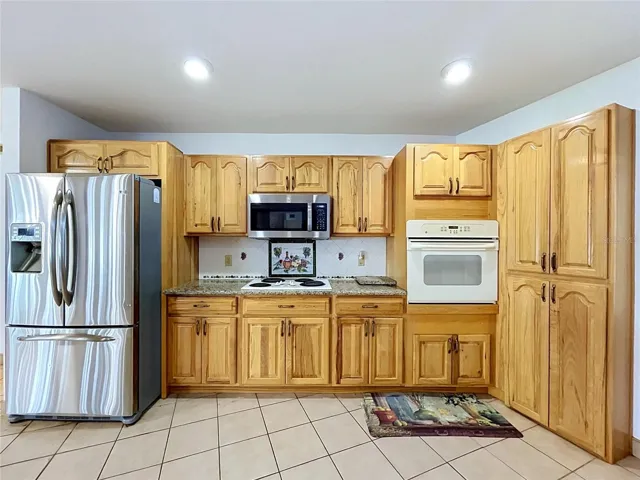 Kitchen cabinetry, countertops, and appliances
