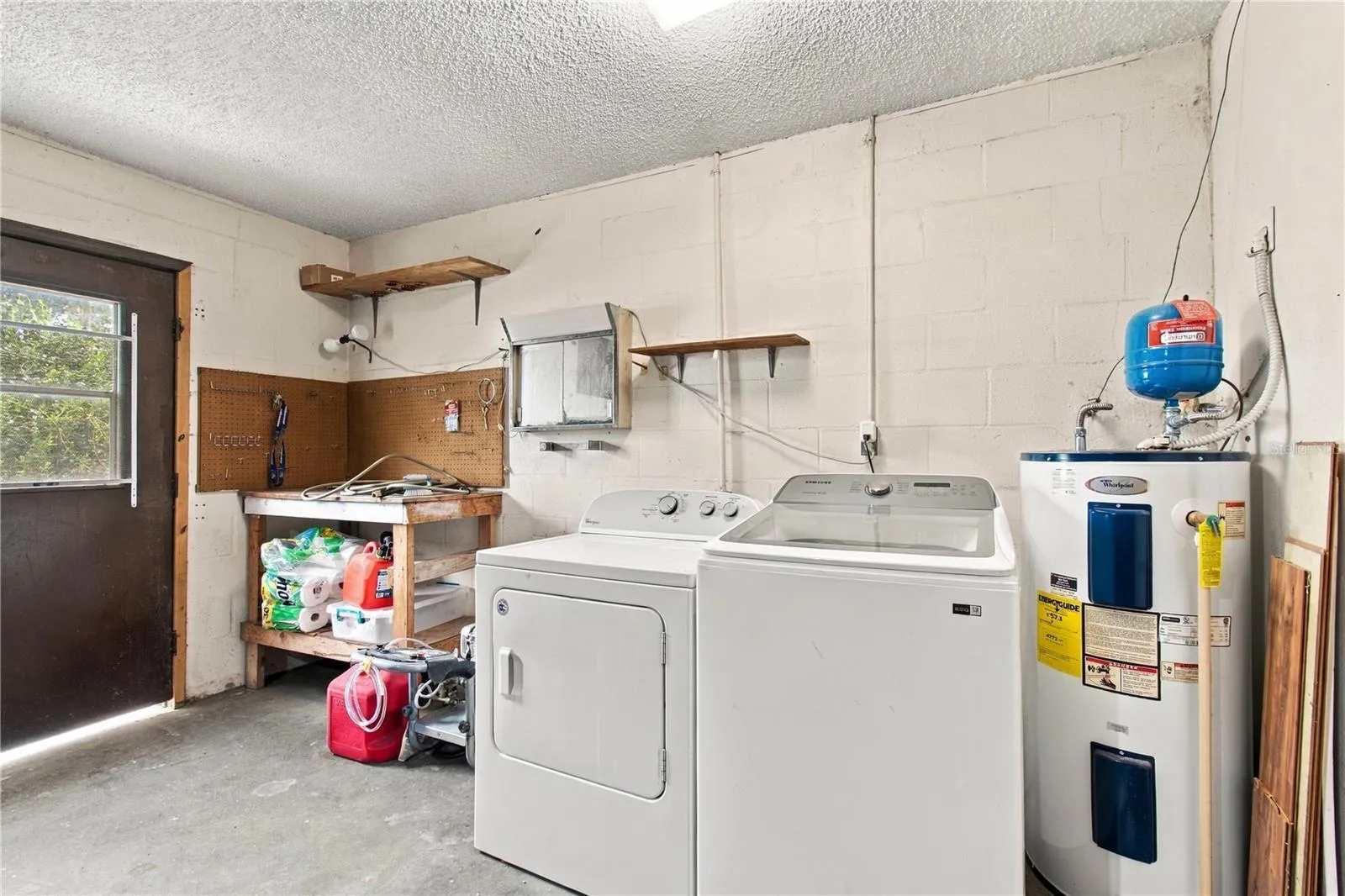 Washer, Dryer, and Water Heater are in the Garage