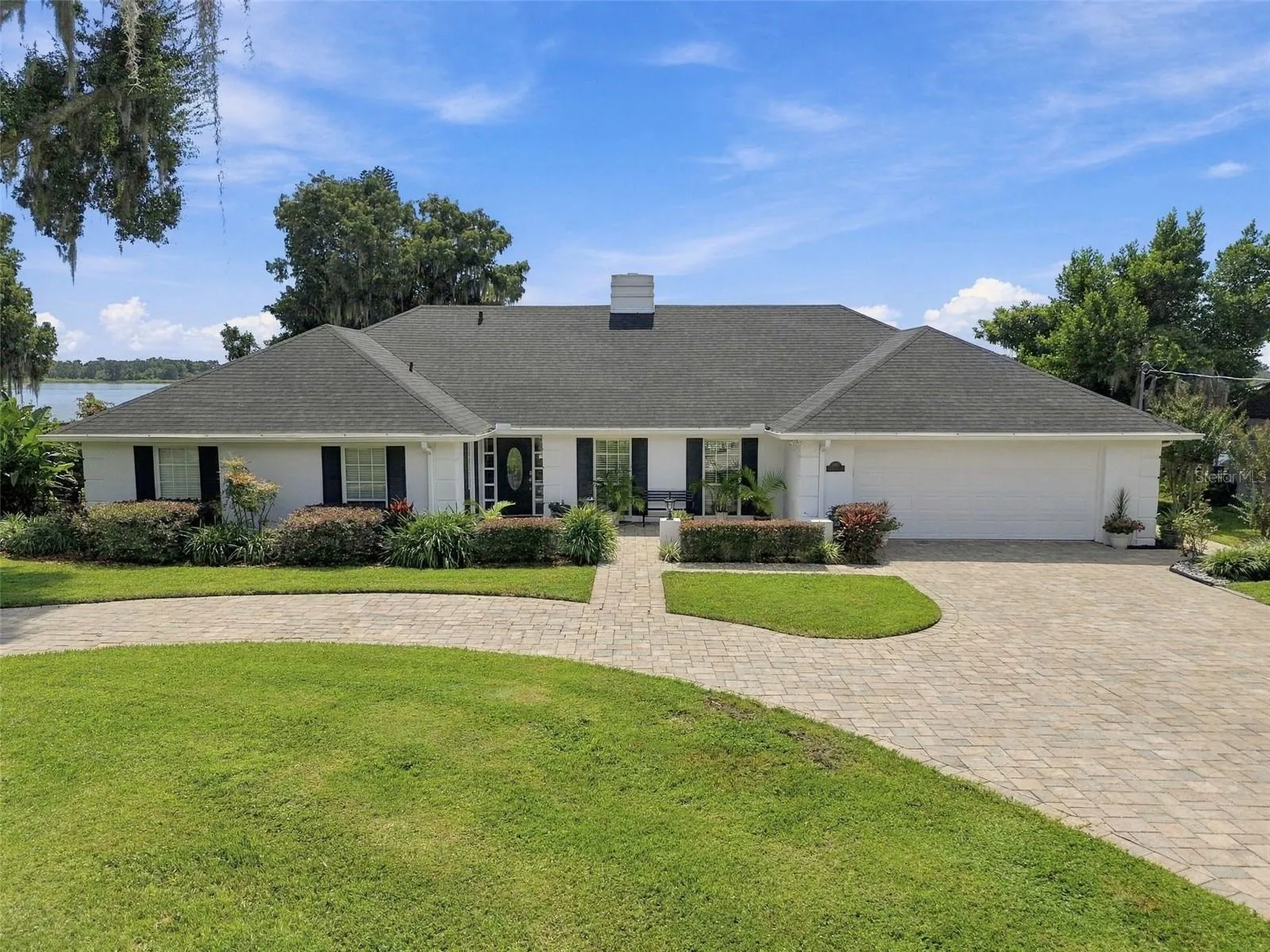 Front exterior - circle brick paved drive, walkways & courtyard