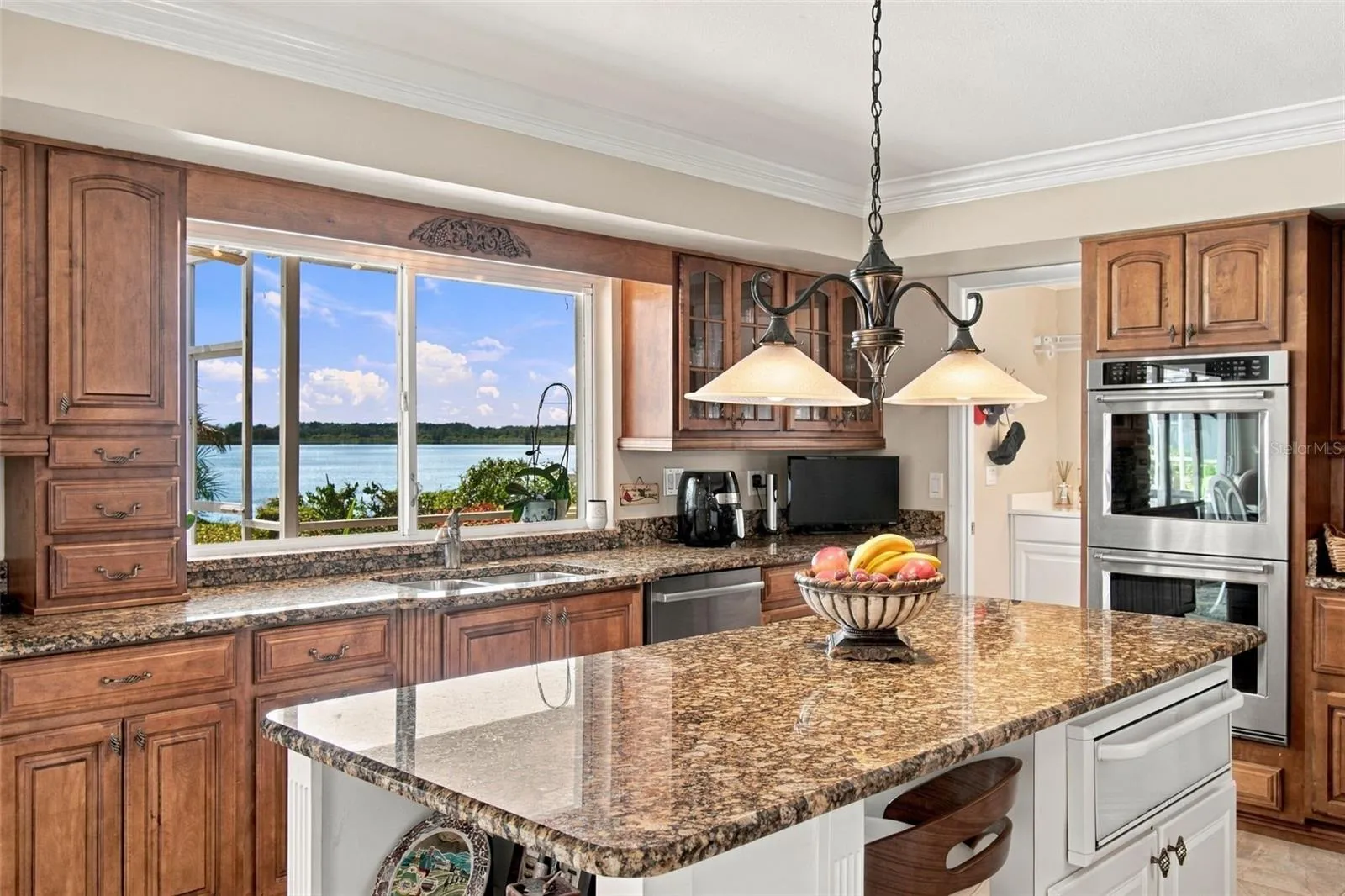 Lakeview kitchen - Pendant lighting & pass through window to outside bar