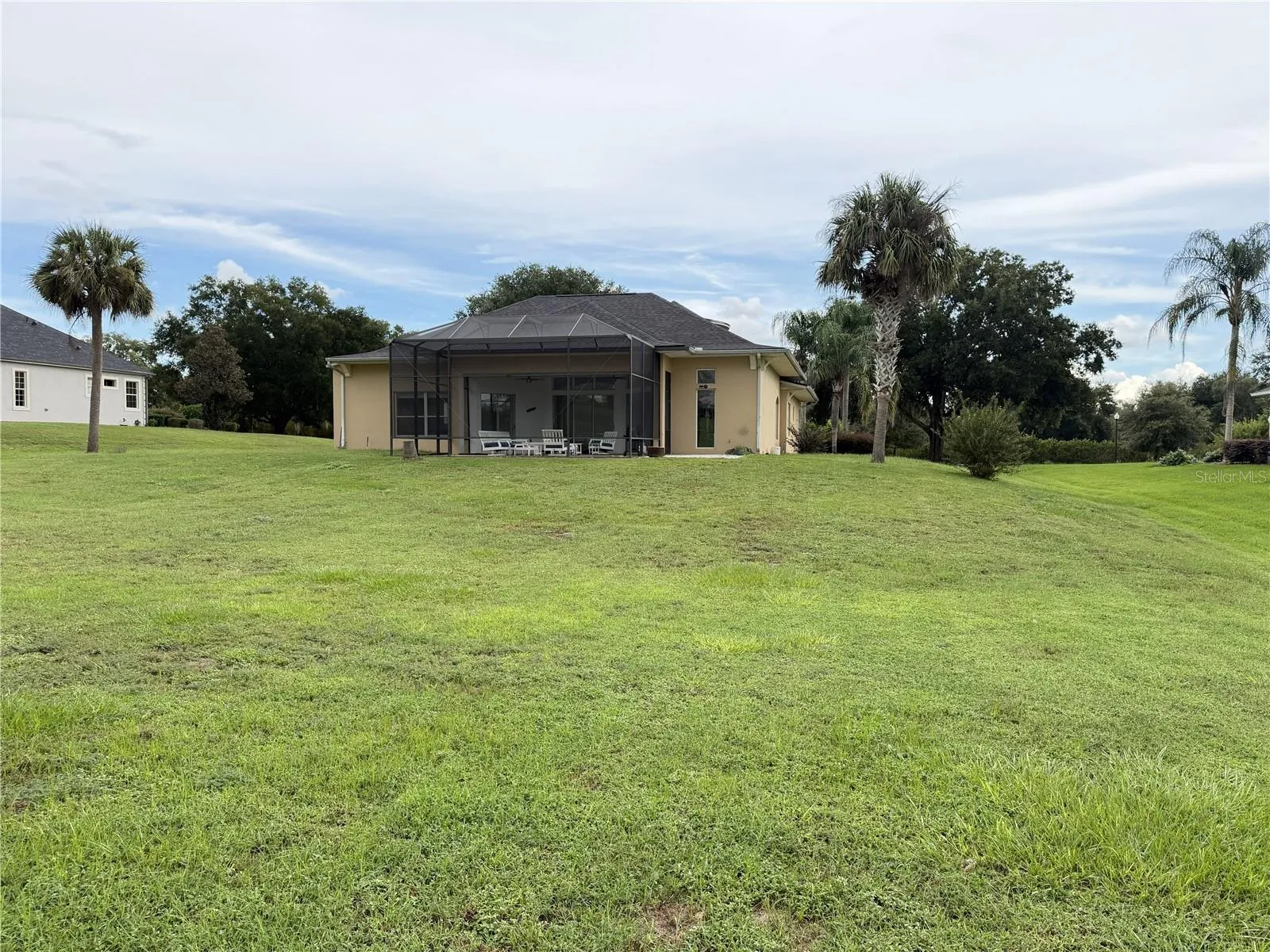 Rear lawn of the 0.63-acre homesite adjoining the Harbor Hills golf course.