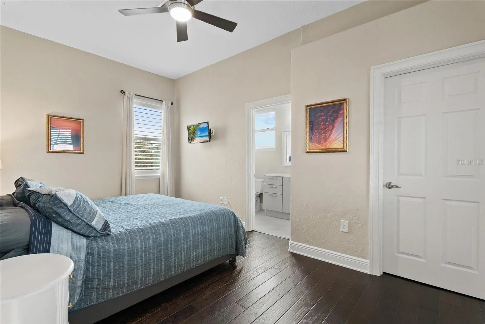 Bedroom five is also upstairs, with a walk-in closet and private ensuite bath