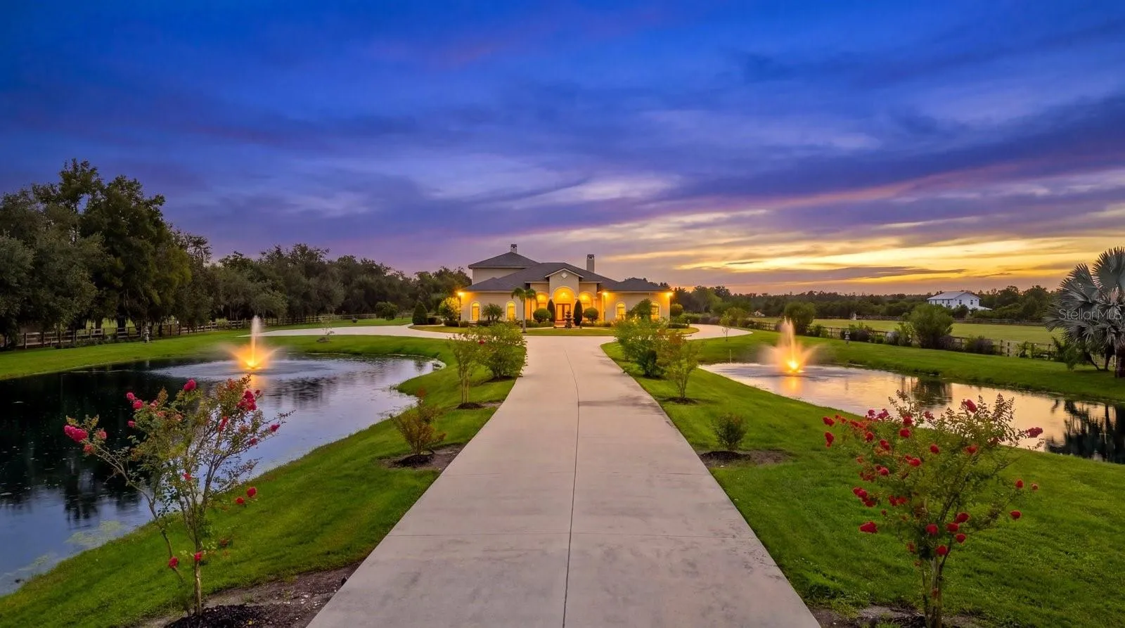 The young crepe myrtle trees will soon grow into a wall of color as you cruise the long drive to your new home