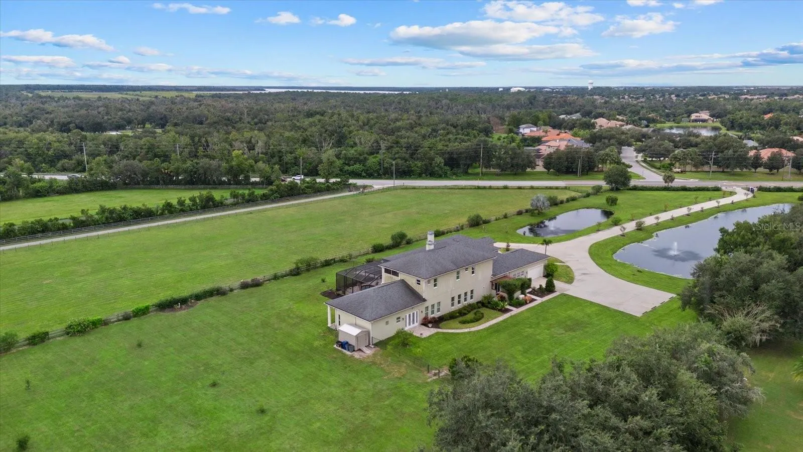 A large parking pad on the south side of the home is large enough for a motor home or bus.  The walkway shown leads to the conference room/inlaw suite