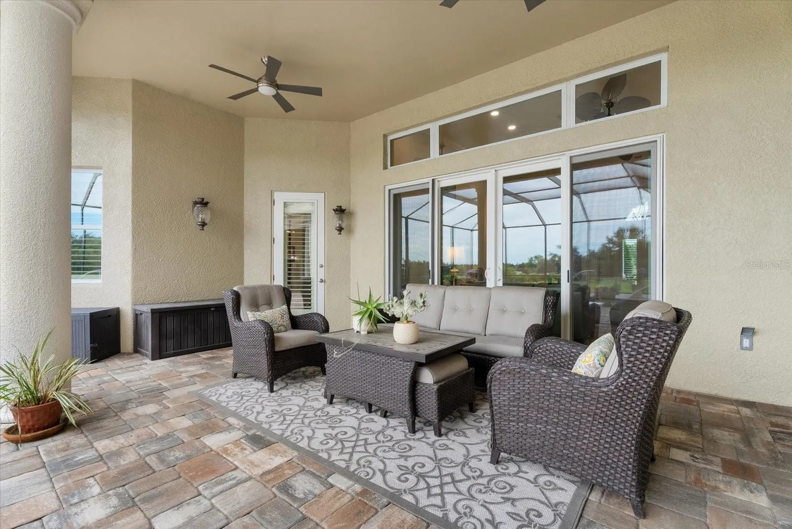 Back downstairs on the pool deck you'll find two separate lounges.  This one is off the living room and primary suite