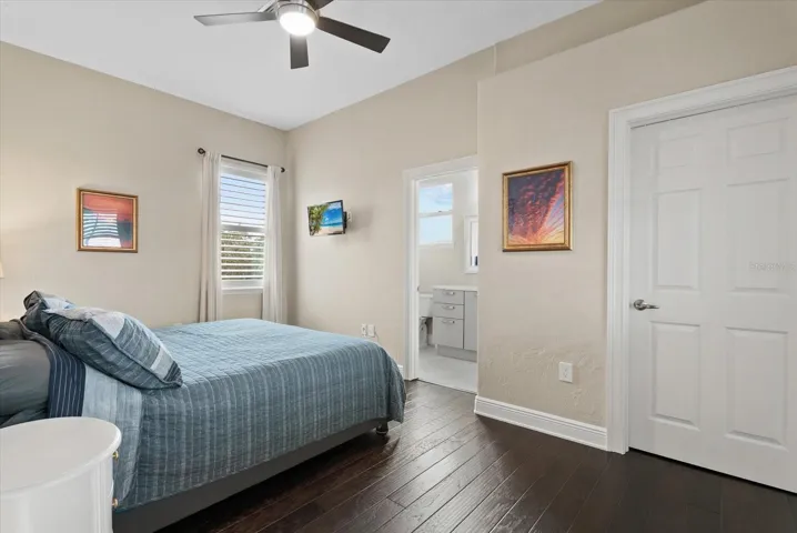 Bedroom five is also upstairs, with a walk-in closet and private ensuite bath