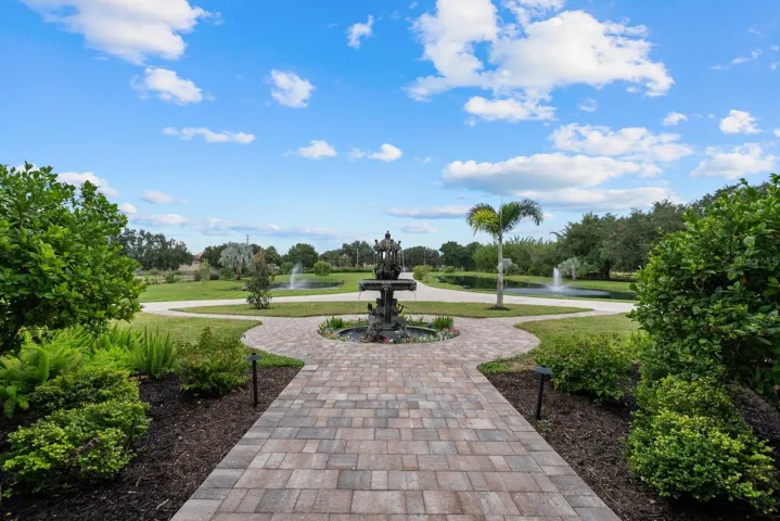 Looking out from the front door towards the large bronze fountain, ponds and driveway