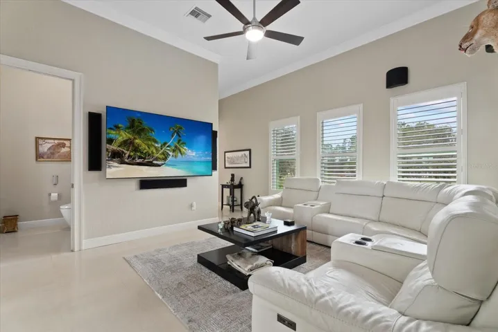 The view shows the media room, and the hall bath that opens to the pool deck