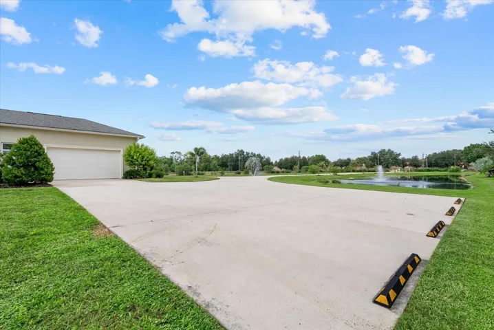 The extended parking pad on the south side of the home