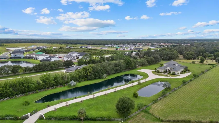 The drone photo gives a nice perspective of the long driveway and two ponds